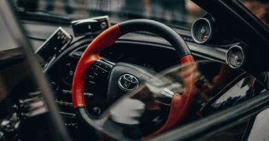 black and red toyota car steering wheel